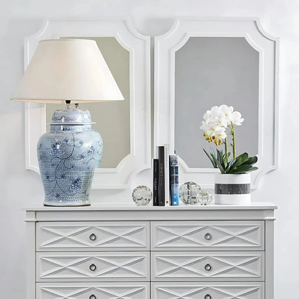 Designer ceramic table lamp on a wooden nightstand