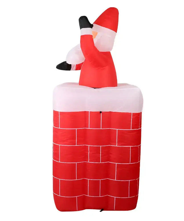 Inflatable Santa in chimney Christmas decoration illuminated for festive outdoor display