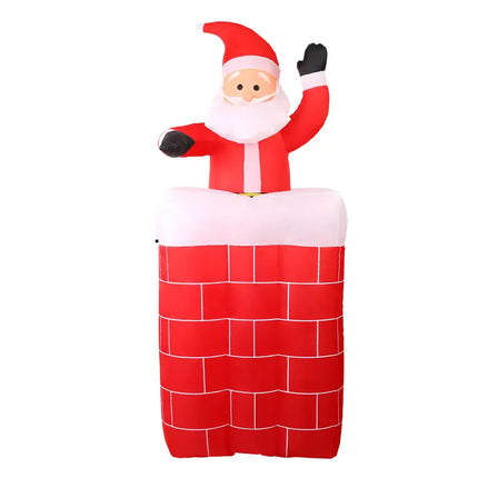 Inflatable Santa Claus emerging from chimney as illuminated Christmas decoration