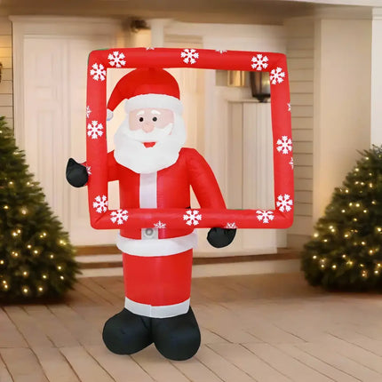 Inflatable Santa holding a snowflake frame for festive seasonal decoration