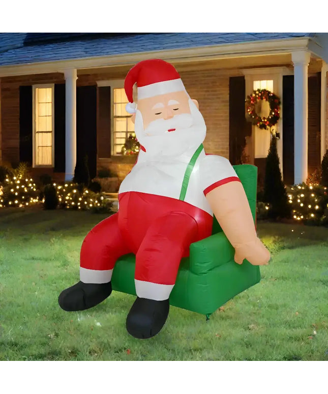 Inflatable Santa seated in a green armchair for the 1.9M Couch Potato Santa Christmas Inflatable