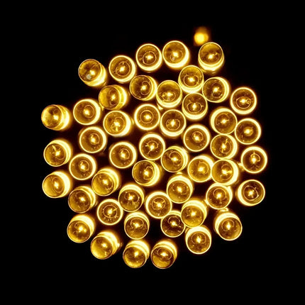 Cluster of glowing warm white LED fairy lights for Christmas decoration