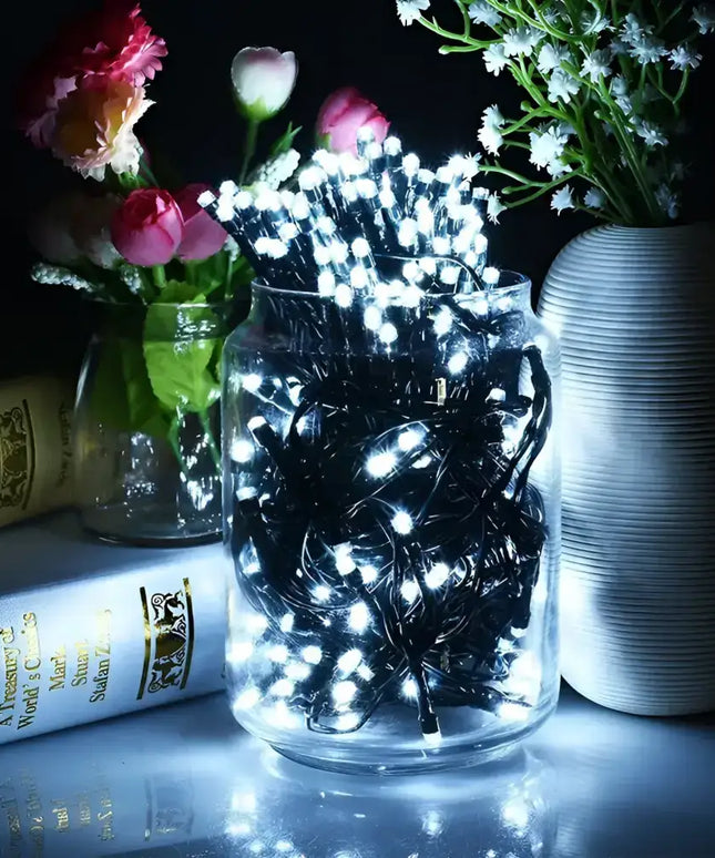 Illuminated string lights in a glass jar for Christmas decoration, cool white low voltage LEDs
