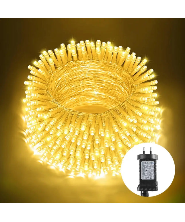 Coiled warm white LED fairy lights with power adapter for holiday decorating