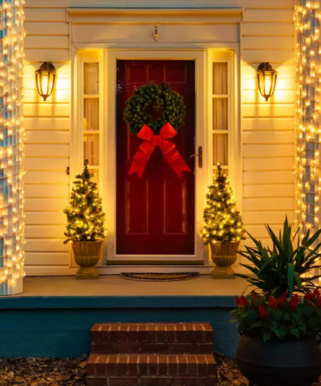 Festive holiday home entrance decorated with 100 Solar LED Fairy Lights in warm white