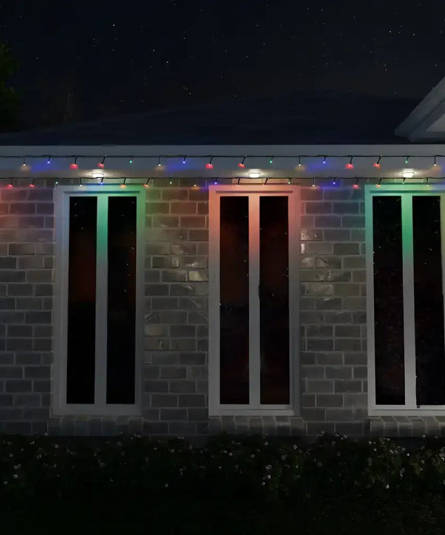 Brick building decorated with multicolor Christmas lights from 1000 LED Fairy Lights set