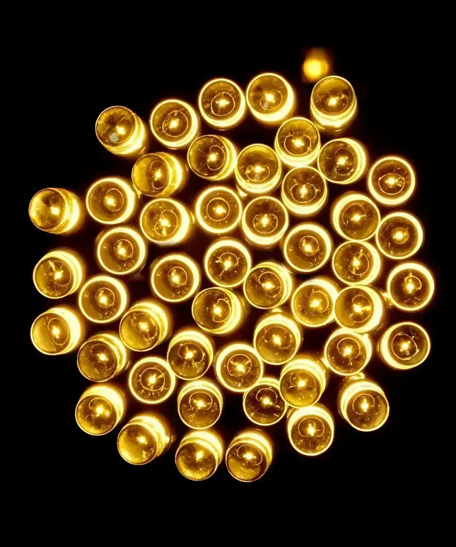 Cluster of glowing warm white LED fairy lights for Christmas decoration