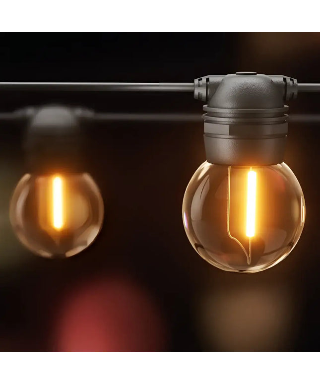 Illuminated string of globe lights for outdoor decoration with 17-meter Black Solar Festoon String Lights and 15 Bulb Plug-in Kit