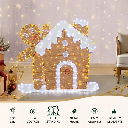 Illuminated gingerbread house and man displayed in 1M LED Christmas Fairy Light Decoration