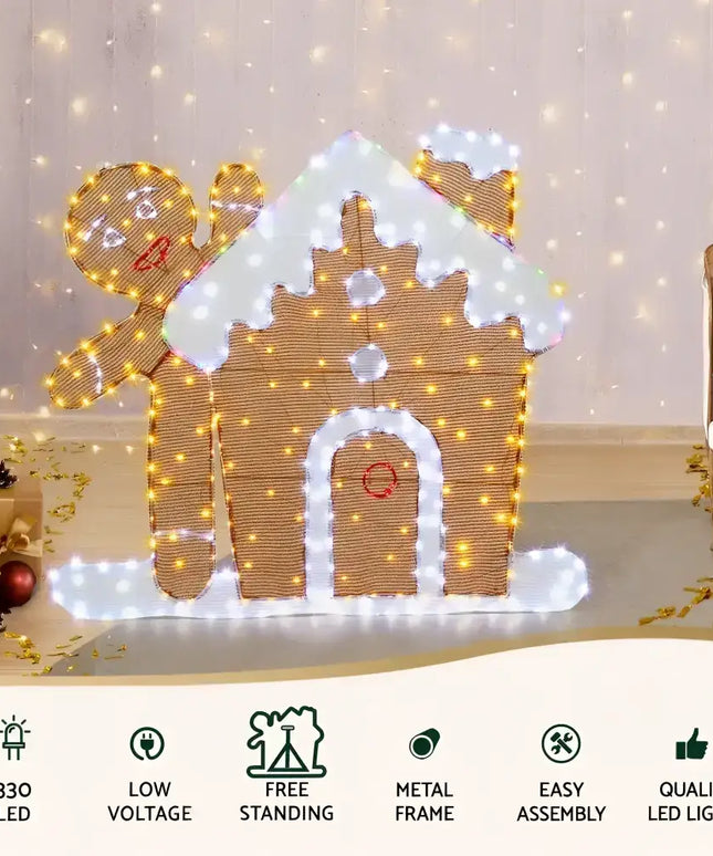 Illuminated gingerbread house and man displayed in 1M LED Christmas Fairy Light Decoration