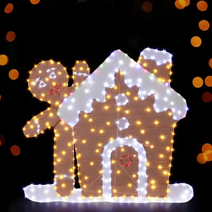 Illuminated gingerbread house and man decoration for Christmas holiday festive display
