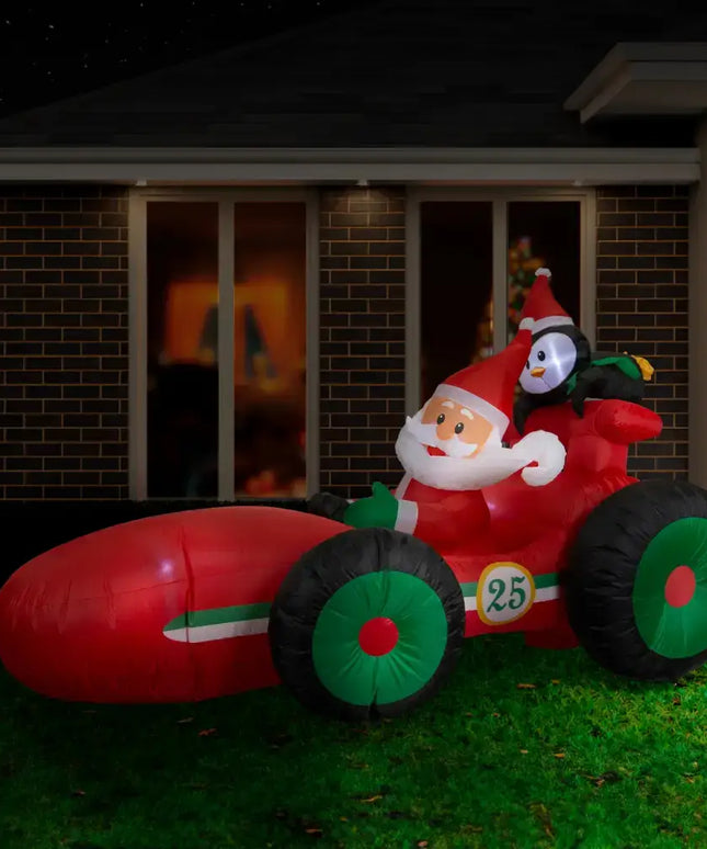 Inflatable Santa and Penguin Race Car decoration displayed in the 2.25M Santa Race Car product