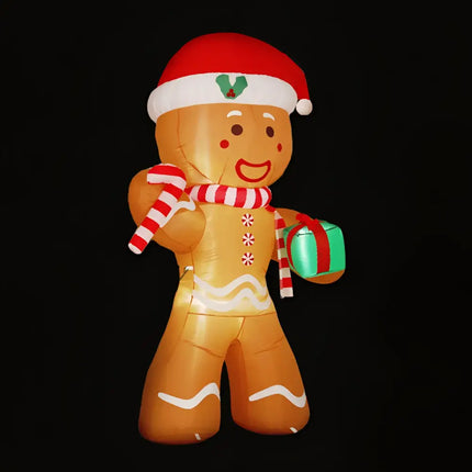 Inflatable Christmas gingerbread man decorated with Santa hat, illuminated for holiday décor