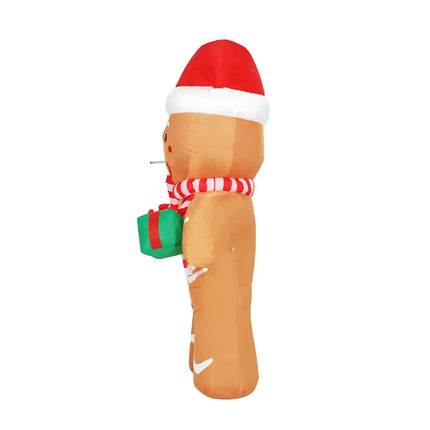 Inflatable gingerbread man with Santa hat and gift, illuminated Christmas decoration