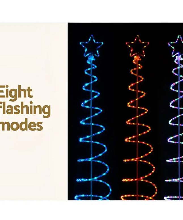 Illuminated spiral Christmas trees with LED solar motif lights for festive decoration