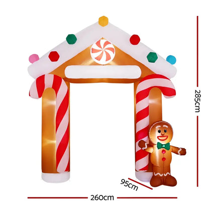 Inflatable gingerbread house archway illuminated for Christmas decorations