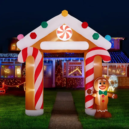 Inflatable gingerbread house archway illuminated for Christmas decorations