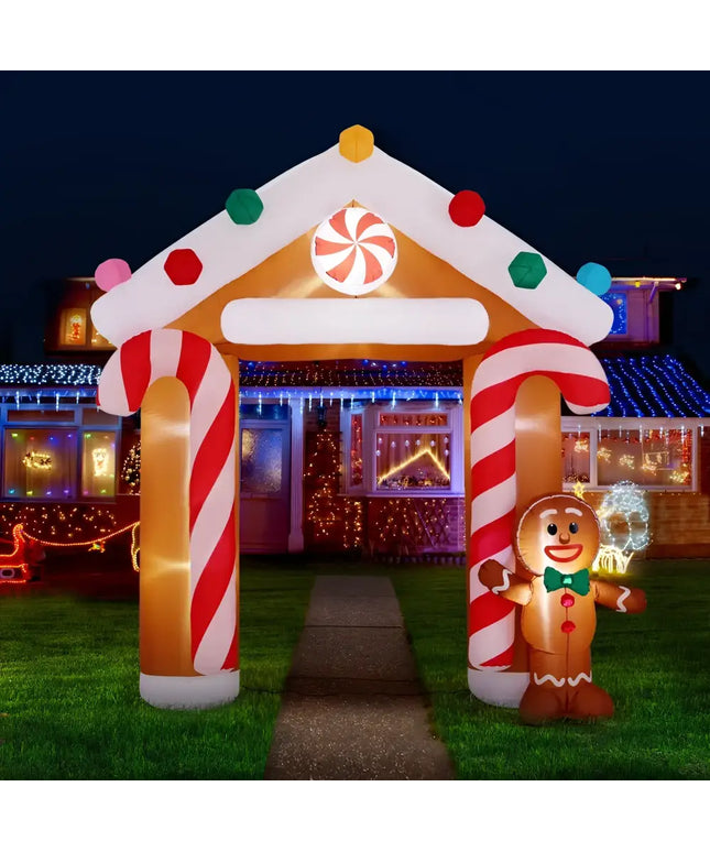 Inflatable gingerbread house archway illuminated for Christmas decorations