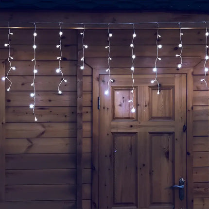 Illuminated icicle lights from 200 Solar Icicle LED Fairy Lights for Christmas decoration