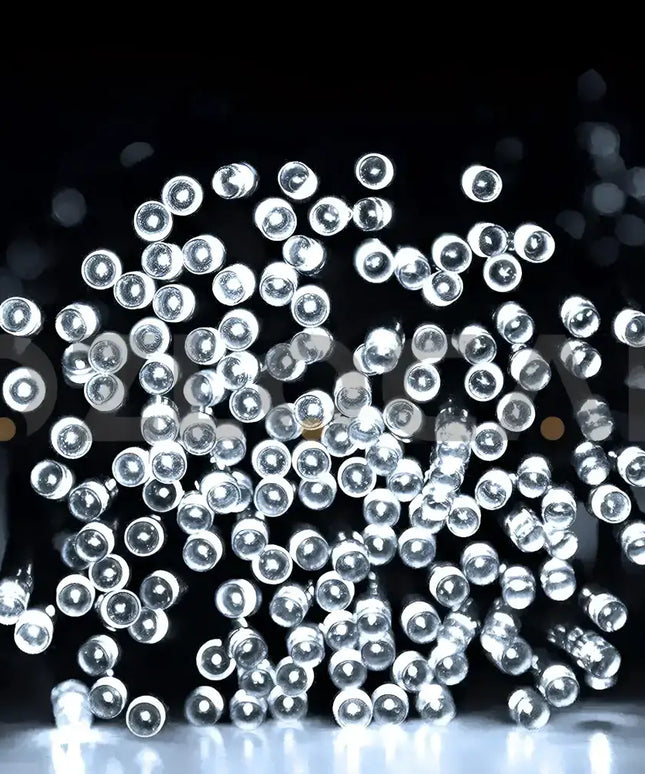 String of white LED fairy lights from 200 Solar LED Fairy Lights 8 Function Memory Hold Multicolor Christmas Decoration Cool White