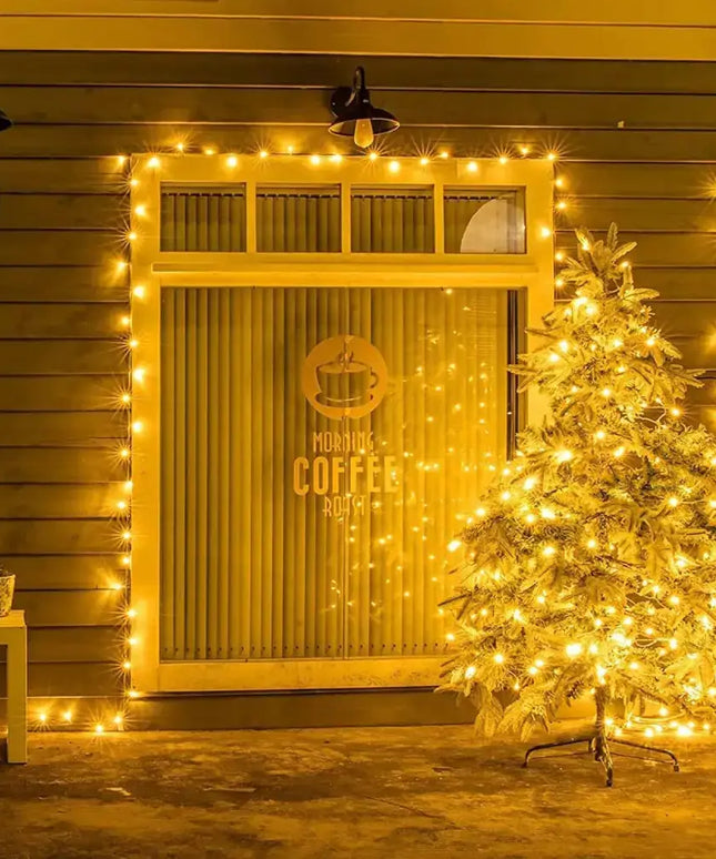 Illuminated Christmas tree decorated with 200 Solar LED Fairy Lights in warm white color