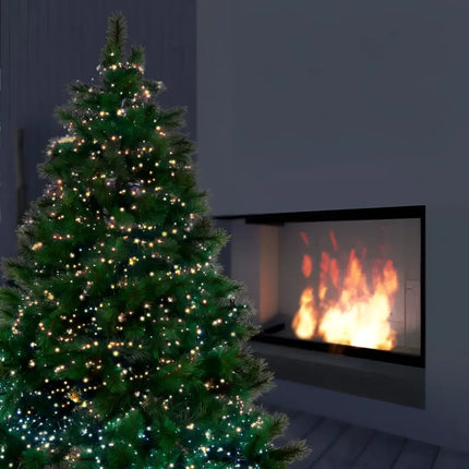 Illuminated Christmas tree adorned with 2000 LED Sparkle Tree Lights in Warm White