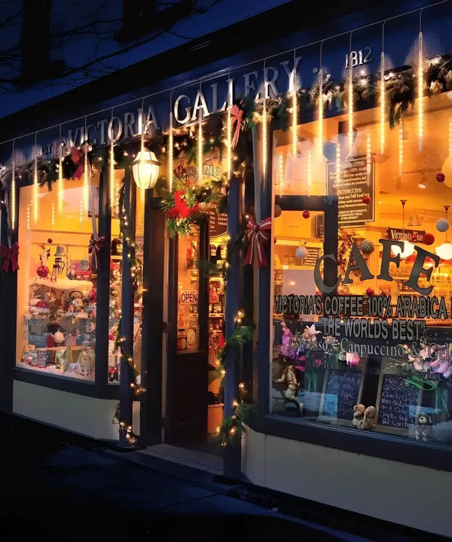 Festively decorated cafe exterior with 240 Outdoor LED Meteor Shower Rain String Lights Christmas Decoration