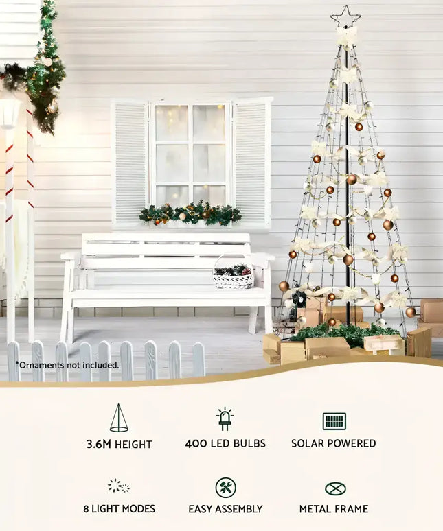 Decorated metal frame Christmas tree with LED solar warm white lights for festive decor