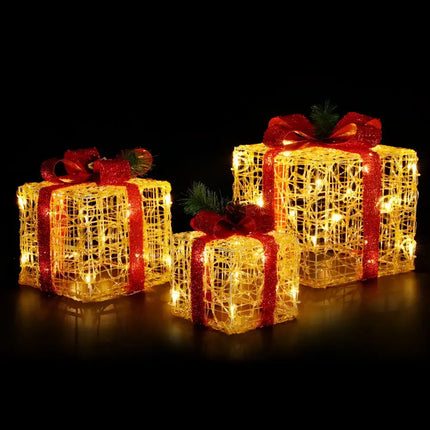 Illuminated Christmas gift boxes with red ribbons from the 3 PCS Christmas Lights Gift Box Set
