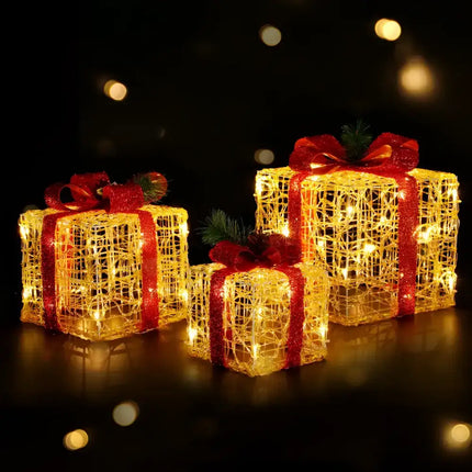 Illuminated Christmas gift boxes with red ribbons from the 3 PCS Christmas Lights Gift Box Set 48 LED Decorations