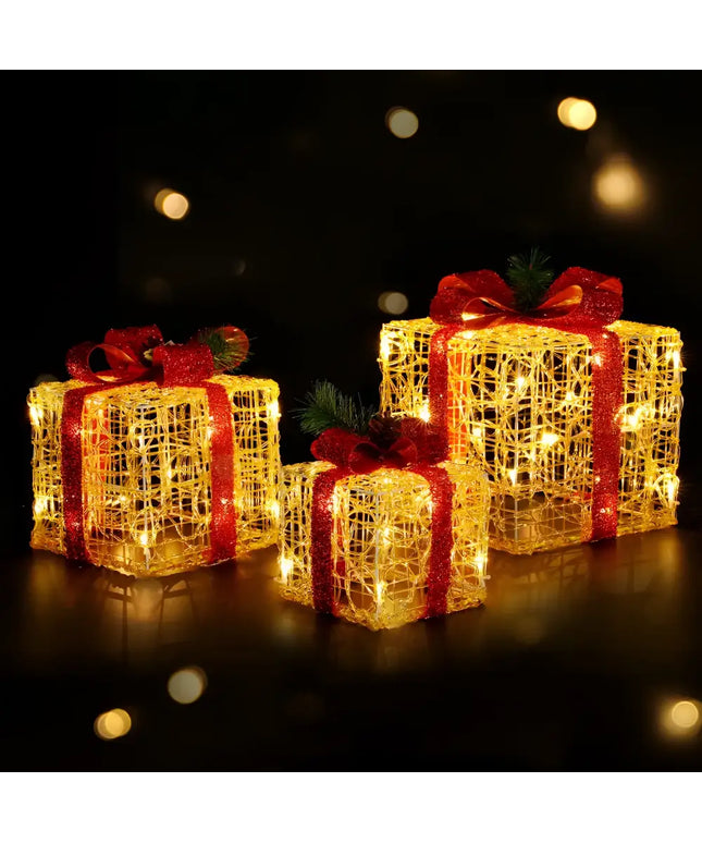 Illuminated Christmas gift boxes with red ribbons from the 3 PCS Christmas Lights Gift Box Set 48 LED Decorations