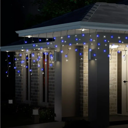 House decorated with blue and white flashing icicle LED lights from 300 LED Icicle Flashing Lights collection