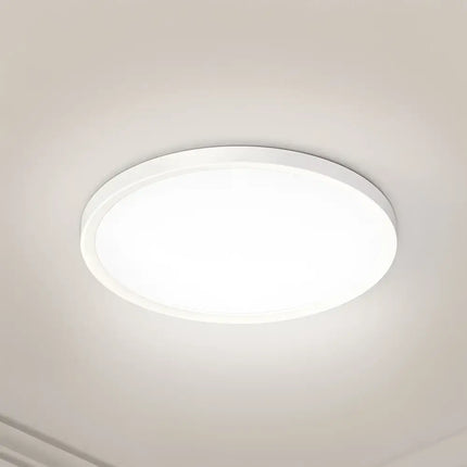 Round white ceiling light from the 31W Tri Colour Ultra-THIN LED Oyster Lamp 30cm