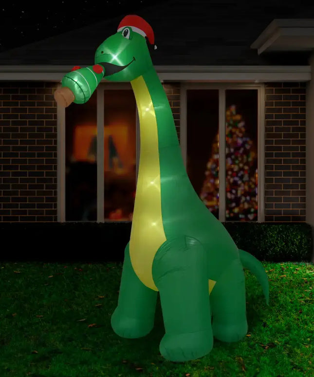 Inflatable green dinosaur with Santa hat and LED lights from 3M Giant Brontosaurus series