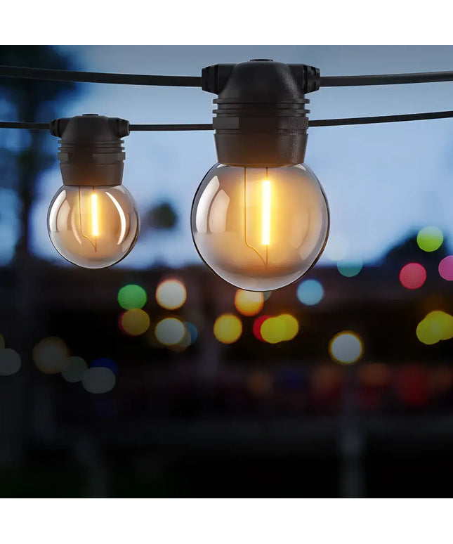 Illuminated 41m Black Solar Festoon String Lights with 40 Bulb Plug-in Kit at night