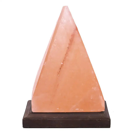 Modern pyramid Himalayan salt lamp illuminating a room with soft amber light.
