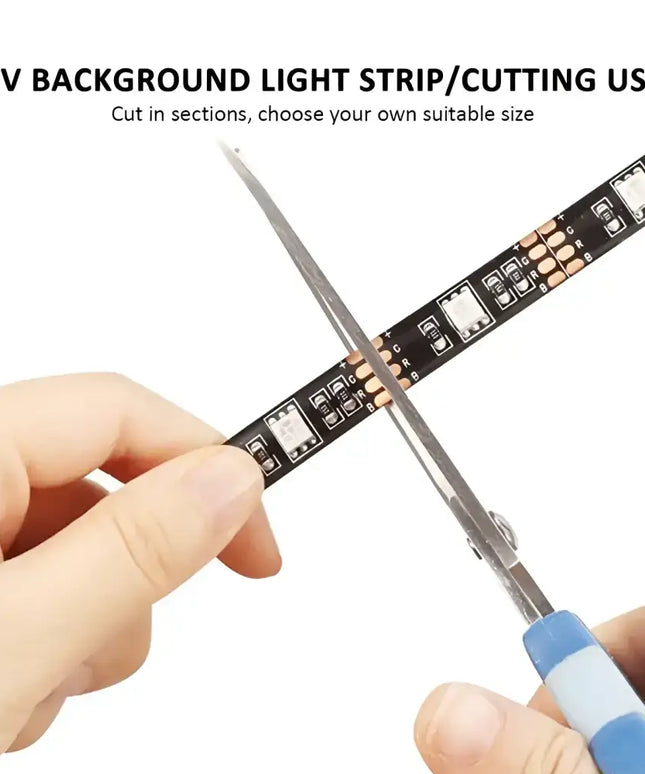 LED light strip being cut from the 4M RGB LED Strip Lights IP65 Waterproof 5050 300 LEDs 12V USB Bluetooth Gift