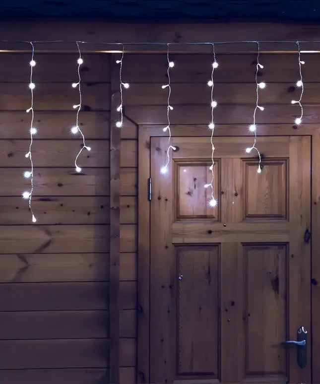 Illuminated cool white solar icicle LED fairy lights for Christmas decoration