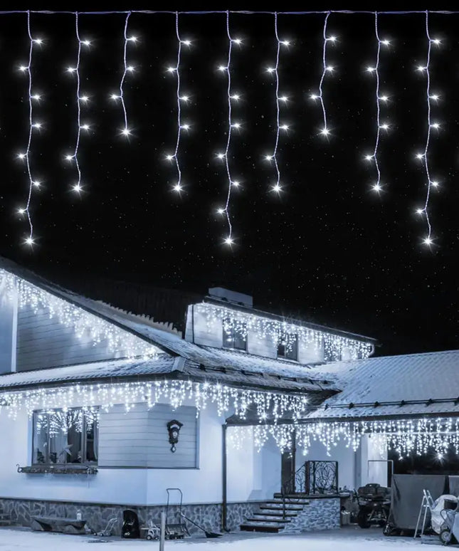 Illuminated icicle Christmas lights on 500 Solar Icicle LED Fairy Lights for festive decoration