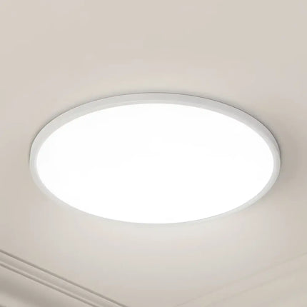 Round white ceiling light from 54W Tri Colour Ultra-THIN LED Oyster Lamp 60cm
