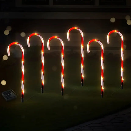 Illuminated candy cane lawn decorations showcased with Solar LED Christmas Lights Path Ground Lights