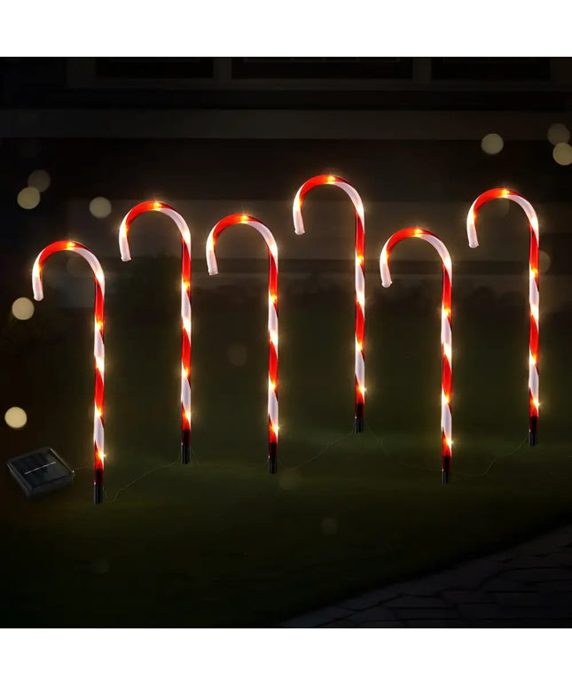 Illuminated candy cane lawn decorations showcased with Solar LED Christmas Lights Path Ground Lights