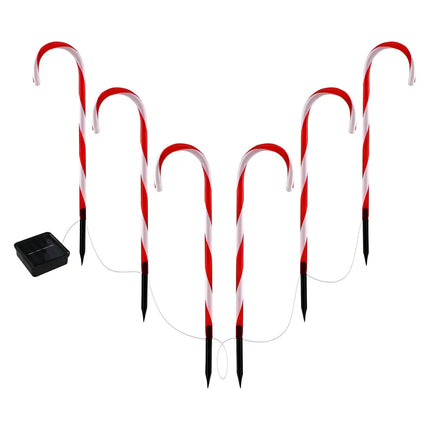 Solar-powered candy cane pathway lights for garden decoration during Christmas season