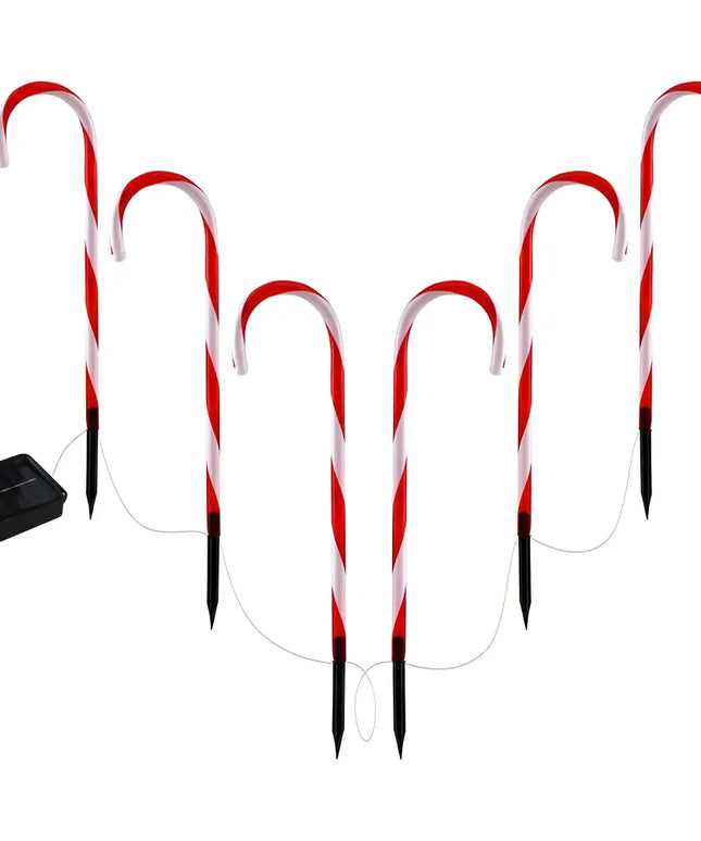 Solar-powered candy cane pathway lights for garden decoration during Christmas season