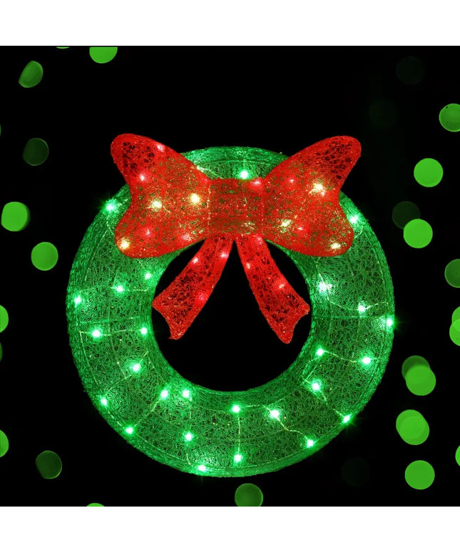 Illuminated green wreath with red bow from 60cm Green LED Motif Solar Wreath Christmas Decorations