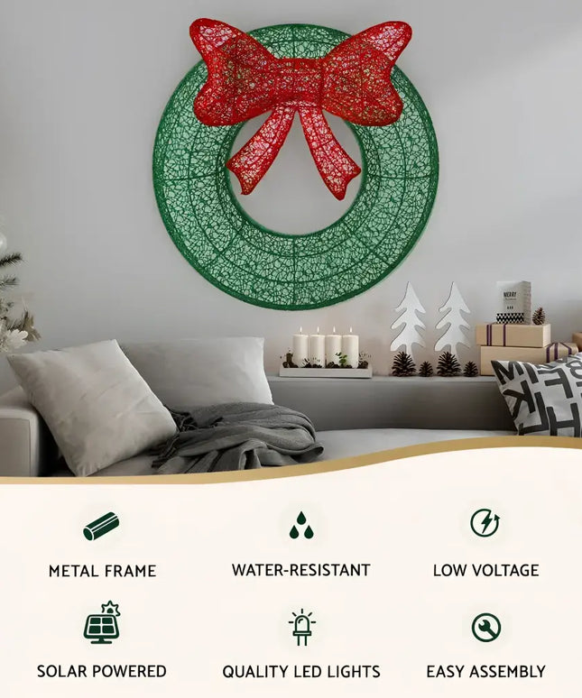 Green Christmas wreath with a red bow, suitable for outdoor holiday decor