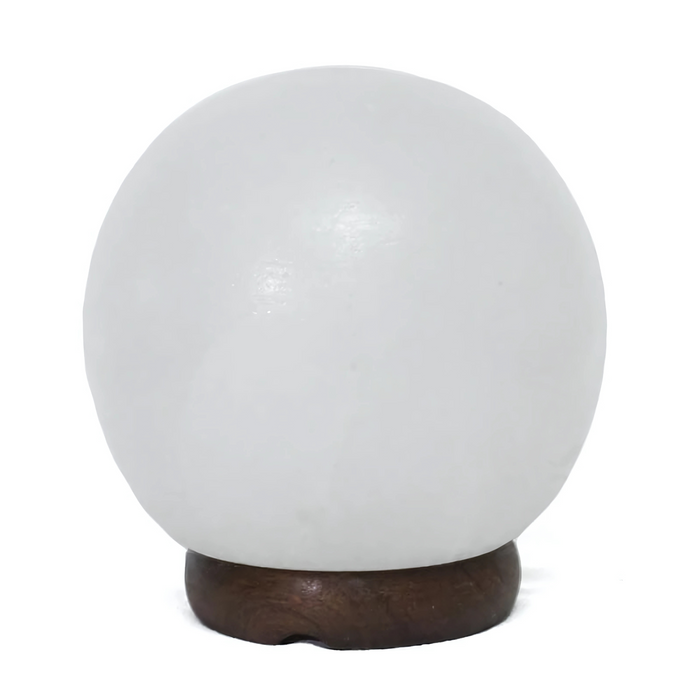 6-inch white sphere salt lamp with a smooth, rounded design and timber base, softly glowing in a serene setting.