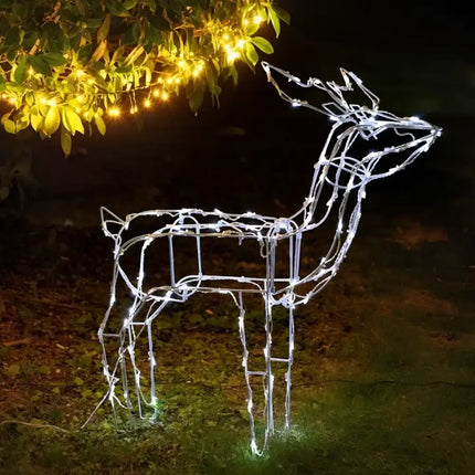 Illuminated wireframe reindeer glowing bright in front of the 80cm LED Reindeer – Standing display
