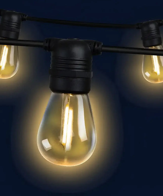 String of glowing vintage-style lights from the 86m Black Festoon String Lights with 90 Bulb Plug in Kit