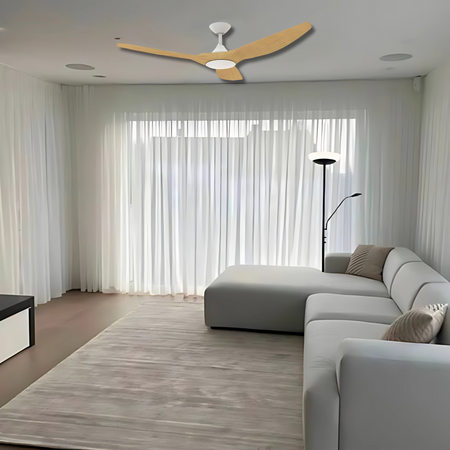 Domus Strike 60" white oak ceiling fan installed in a living room with natural wood accents